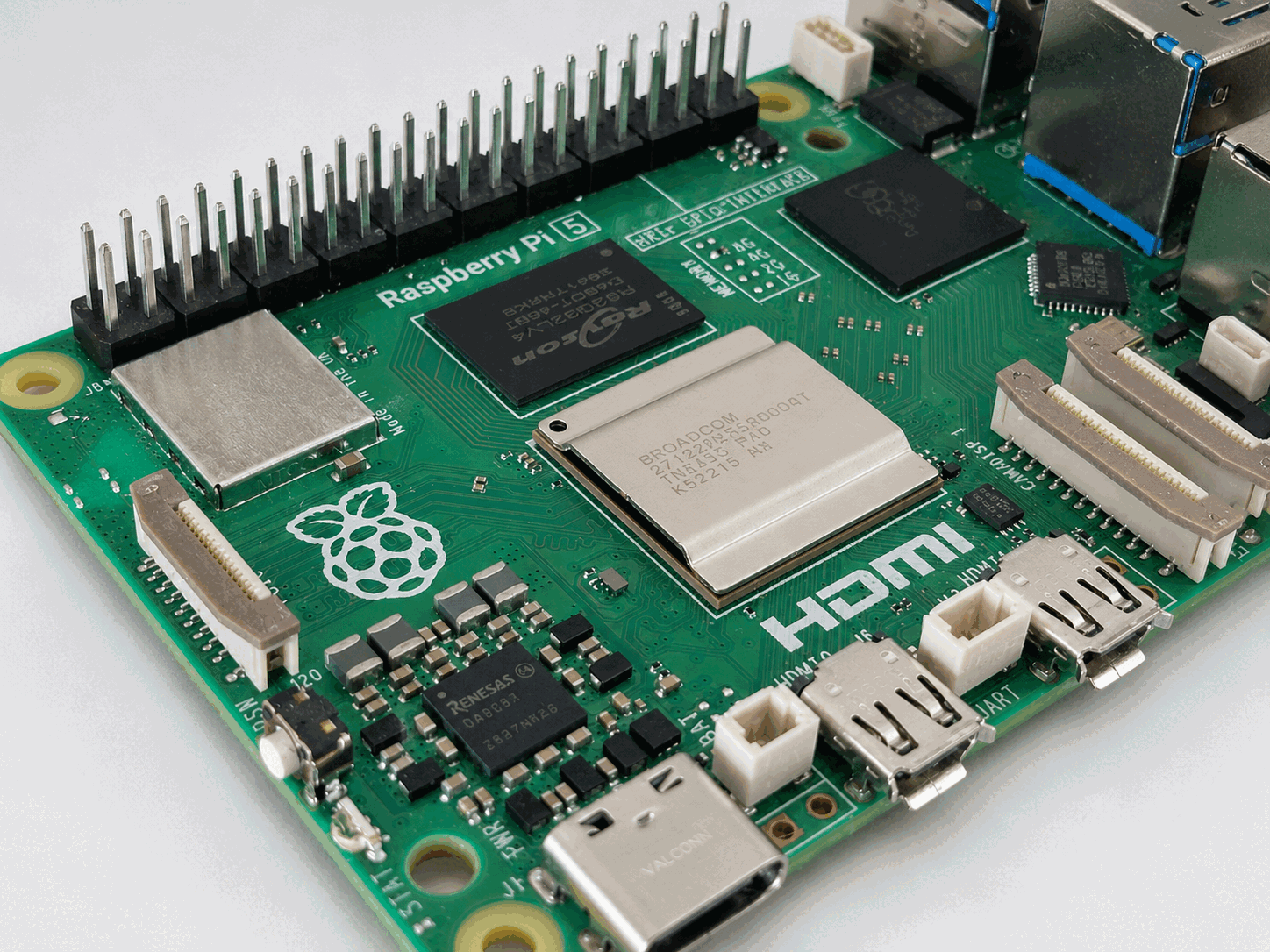 Close-up of a Raspberry Pi 5 board showing its processor, connectors, and GPIO pins.